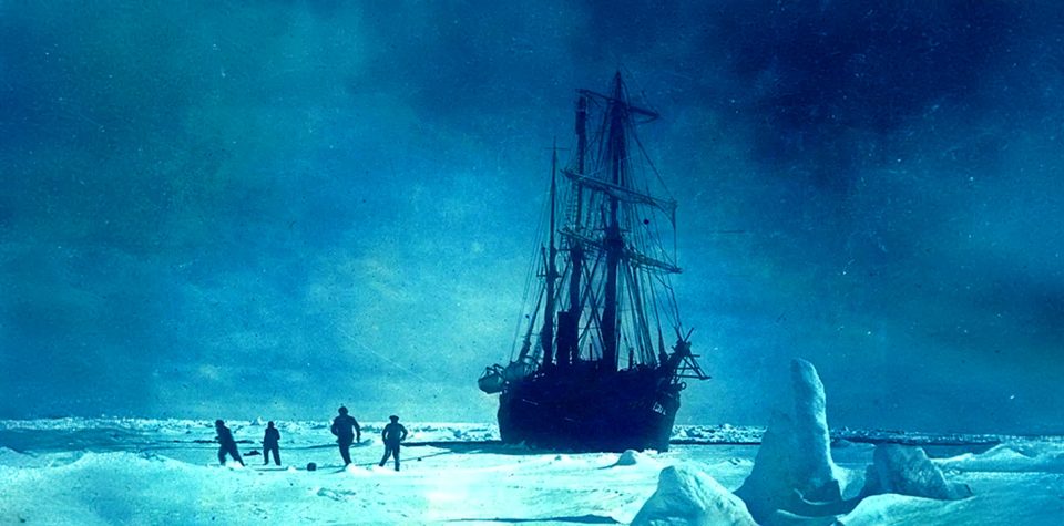 The Endurance trapped in ice with crew fleeing